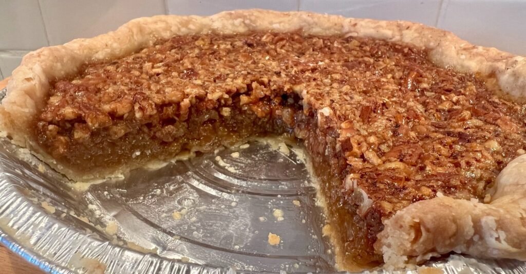 pecan pie with slice removed