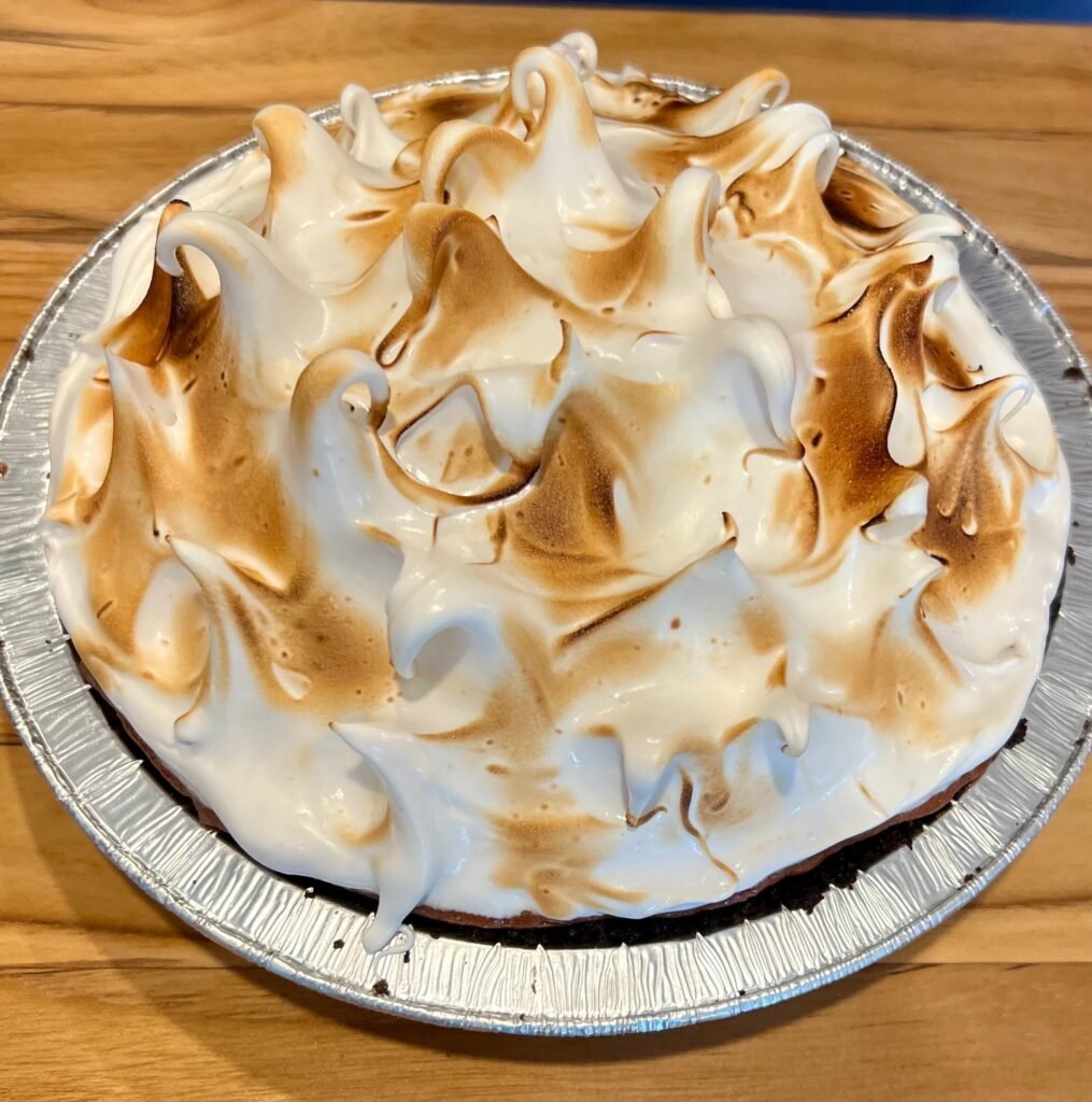 chocolate mousse pie with swiss meringue topping